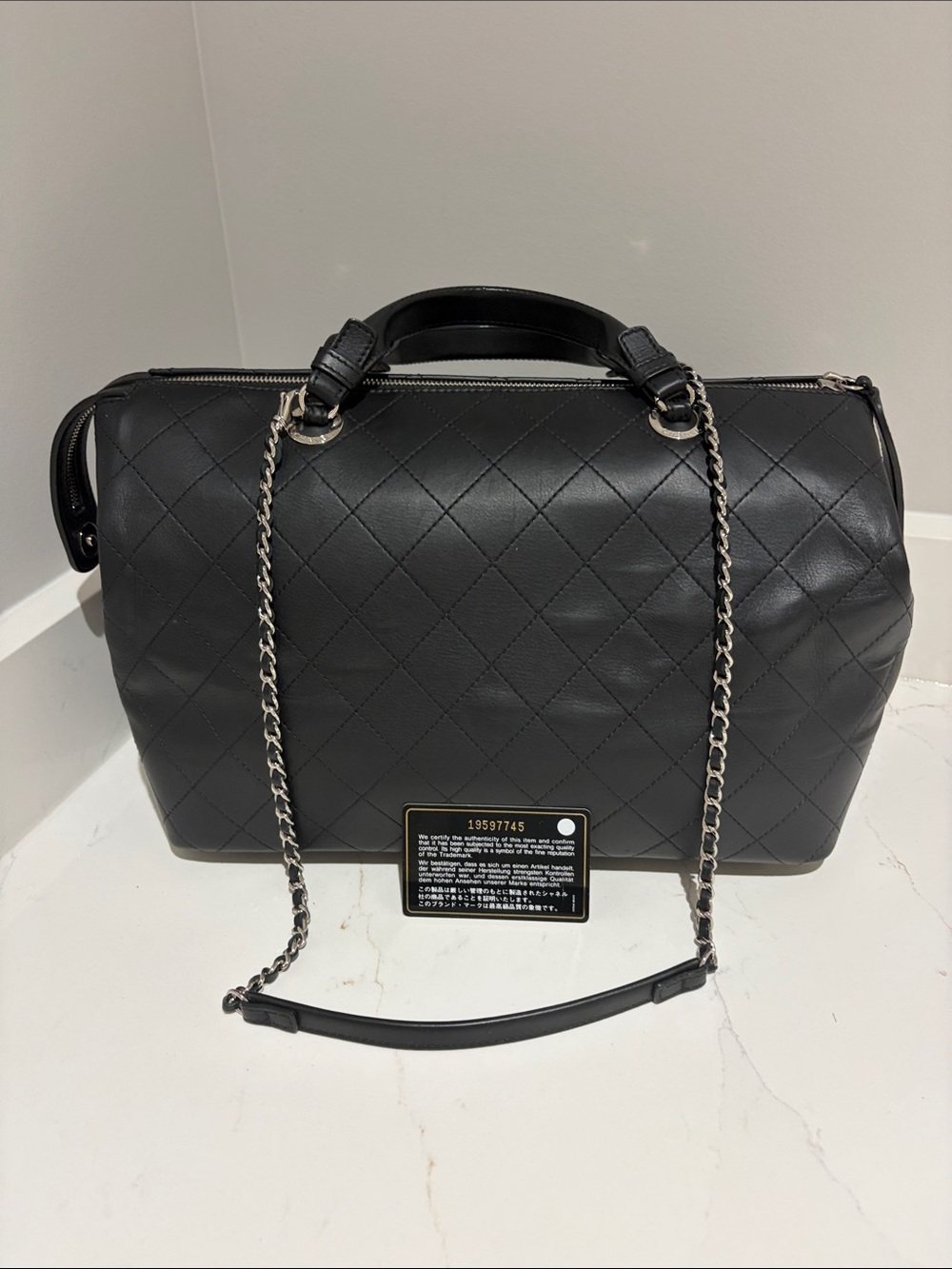 CHANEL Black Quilted Leather Bowling Shoulder Bag with Chain Strap
